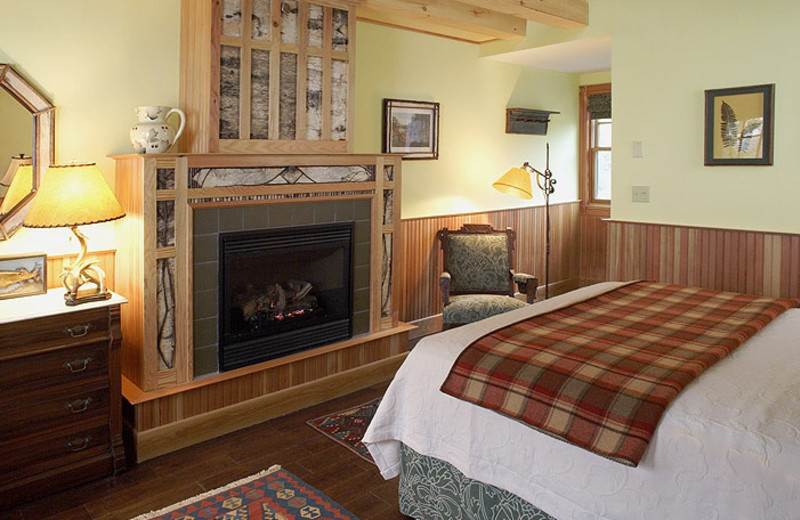 Fireplace guest bedroom at Hotel Mountain Brook.