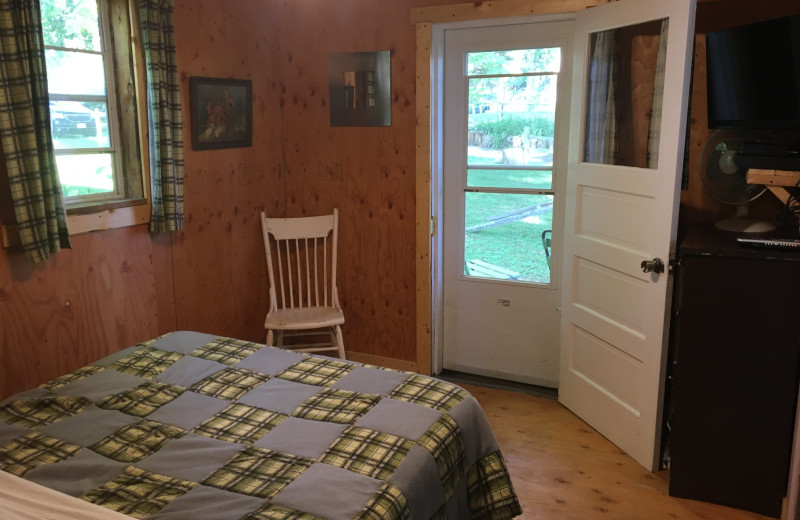 Cabin bedroom at Rainbow's End Resort.