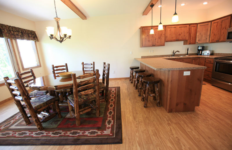 Dining area and kitchen at East Silent Lake Vacation Homes.