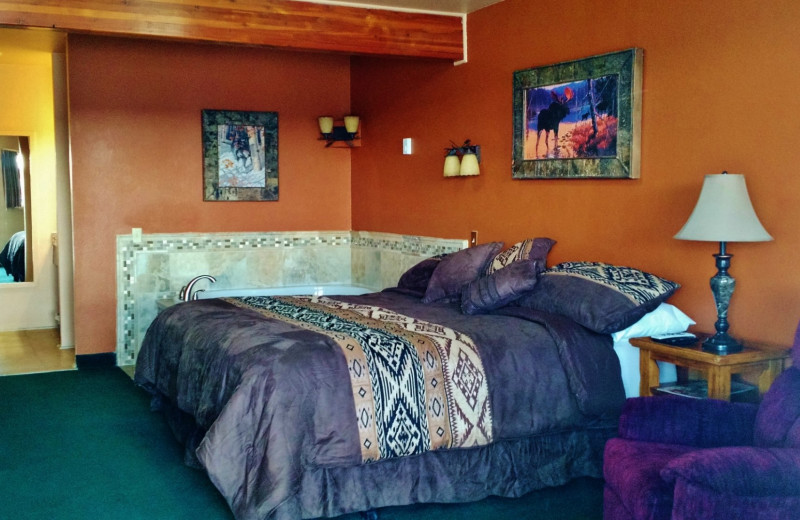 Guest room with jacuzzi at Going to the Sun Inn and Suites.