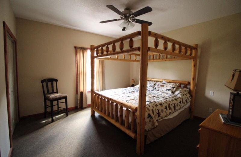 Cottage bedroom at Riverwood Resort.