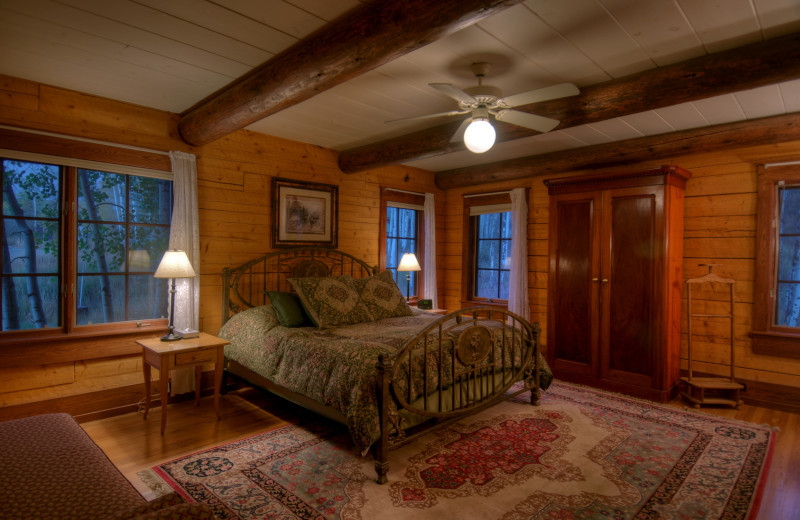 Cabin bedroom at The Home Ranch.