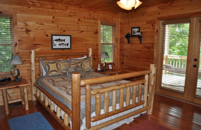 Cabin bedroom at Cuddle Up Cabin Rentals.