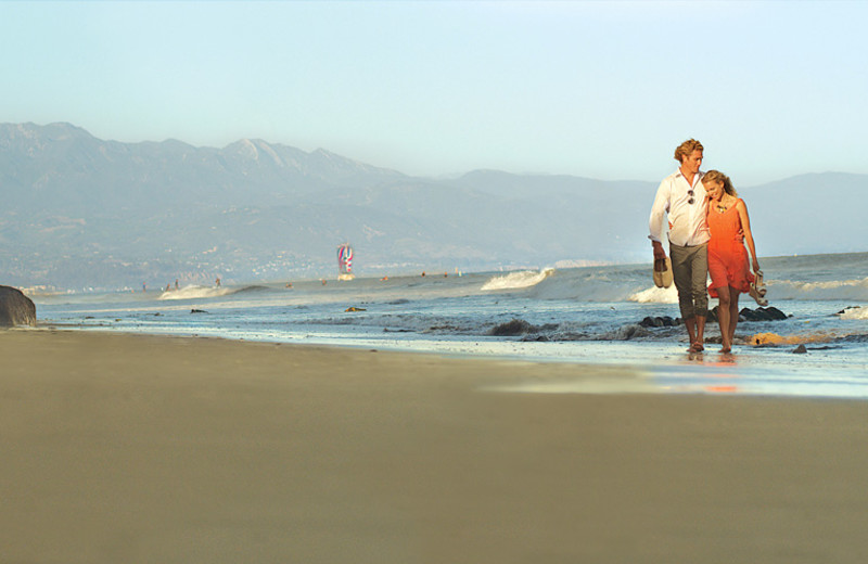 Couple on beach at The Eagle Inn.