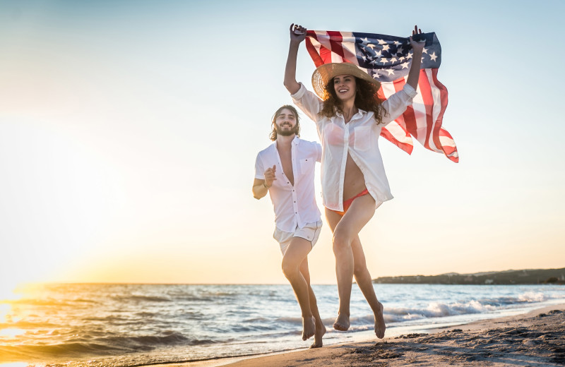 Couple on beach at Amelia Rentals and Management Services.
