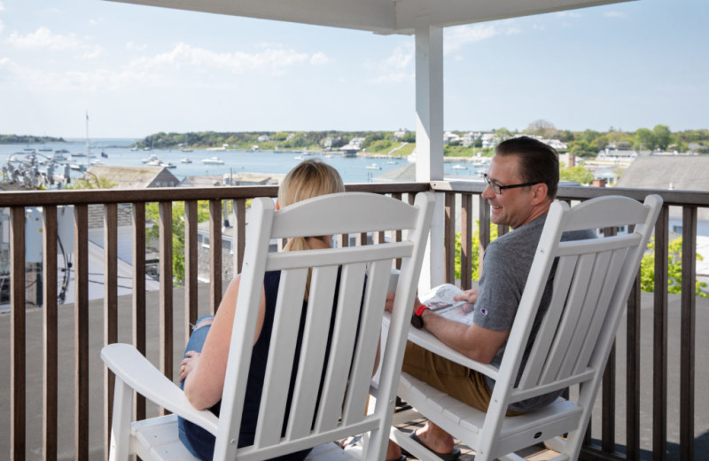 Couple on balcony at Vineyard Square Hotel & Suites.