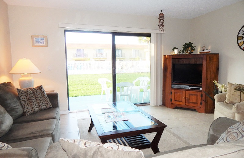 Rental living room at Family Sun Vacation Rentals.