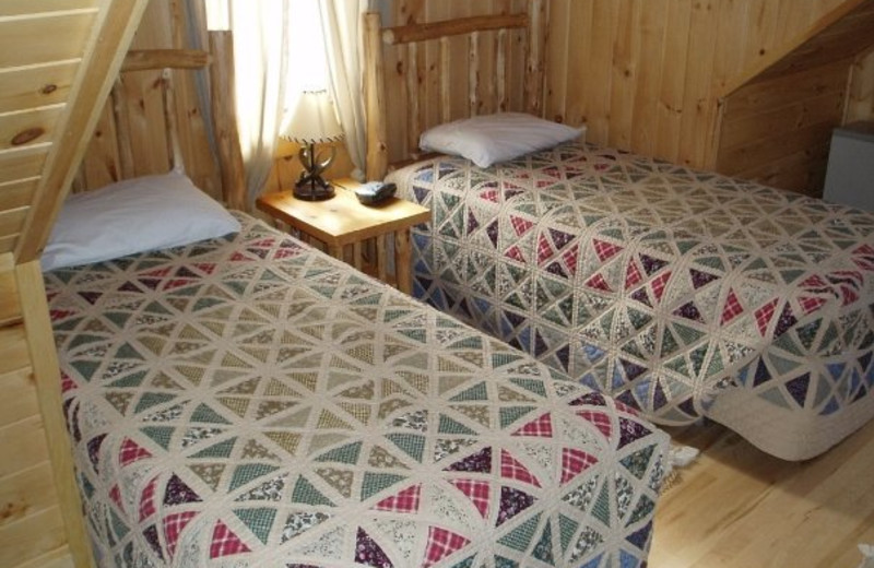 Cabin bedroom at Timber Trail Lodge & Resort.