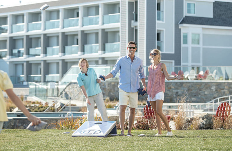 Family playing on grounds at Cliff House Maine.