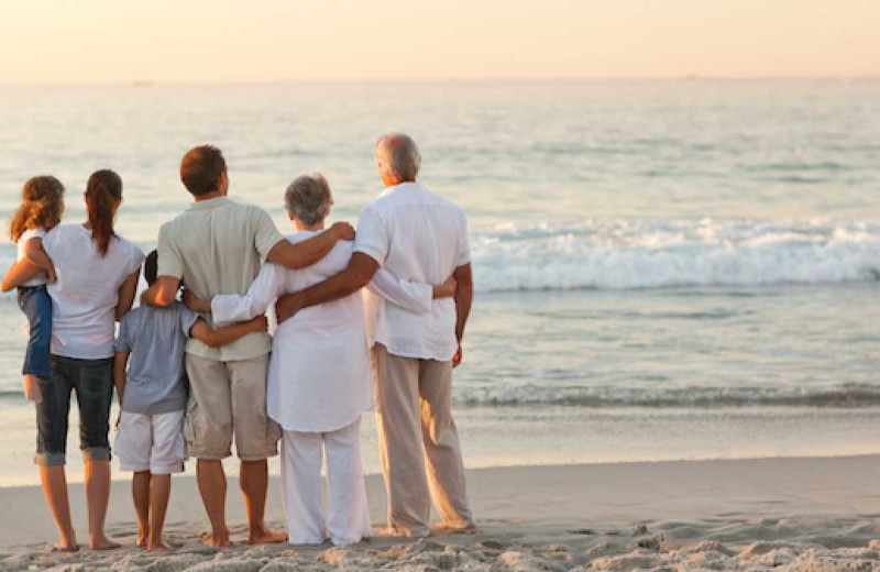 Family on beach at Marigot Beach Suites.