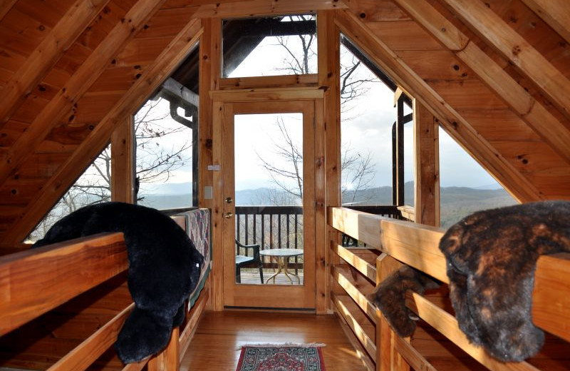 Cabin bedroom at Cuddle Up Cabin Rentals.