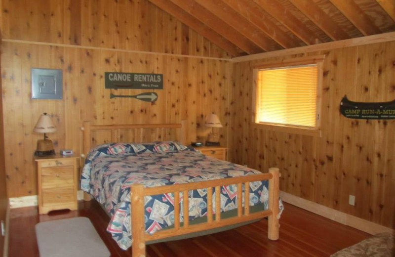 Cabin bedroom at Niemeyer's Rugged River Resort.