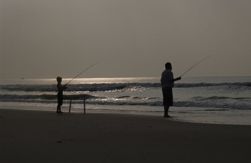 Fishing on the beach at Ocean Isle Inn.