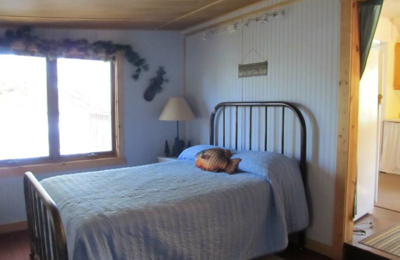 Cabin bedroom at Niemeyer's Rugged River Resort.