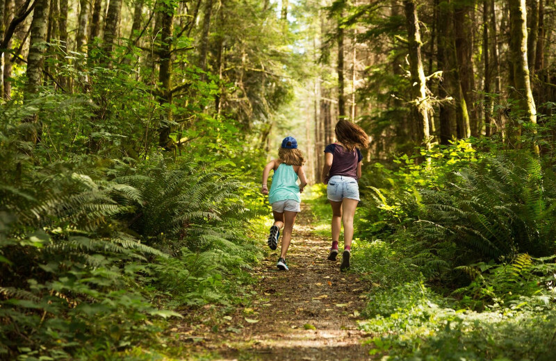 Kids running in the woods at The Resort At Port Ludlow.