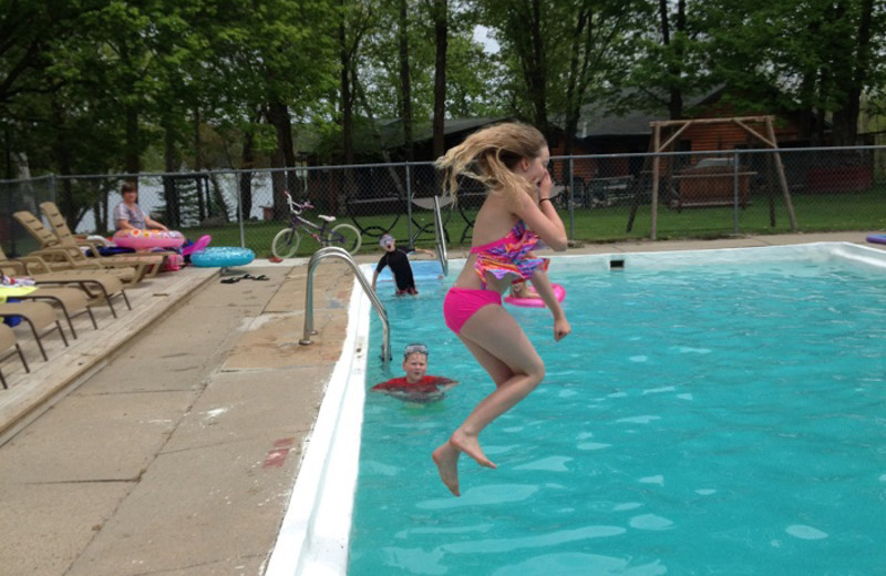 Jumping in pool at Cedar Point Resort.