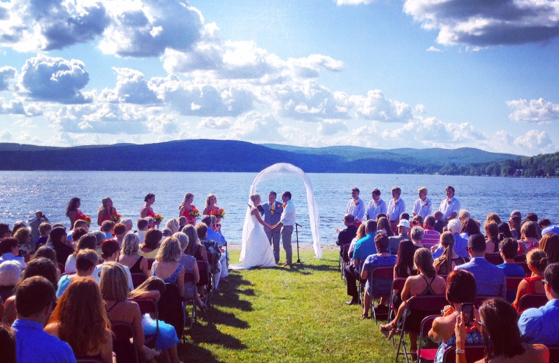 Lakeside backdrop on the beautiful clean sandy beach of Jackson's Lodge on pristine international Lake Wallace, Canaan, Vermont makes a memorable picture-perfect wedding ceremony.