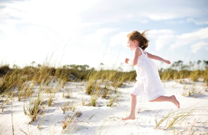 Running on the beach at Newman-Dailey Resort Properties, Inc. 