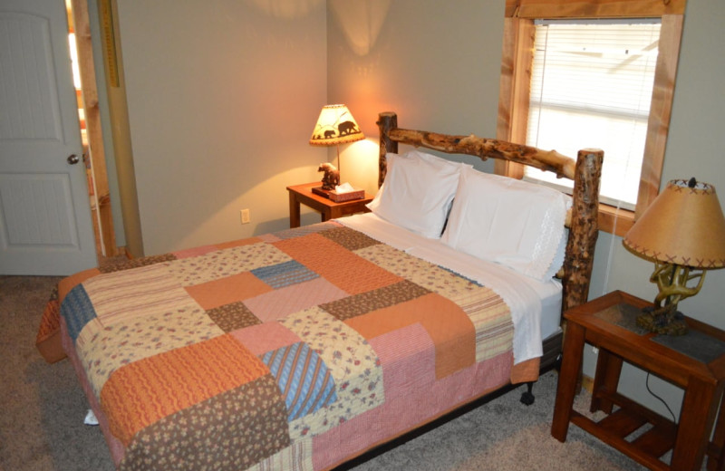 Cabin bedroom at Mulberry Mountain Lodging & Events.