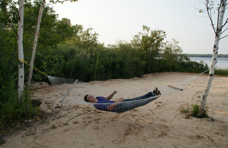 Relaxing on beach at Freshwater Vacation Rentals.