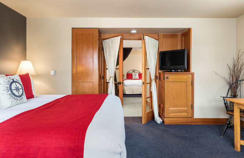 The main room has a king size bed, gas fireplace, microwave, jetted Jacuzzi tub and shower combination with an adjoining side room includes a queen bed, sitting chair and writing desk. 