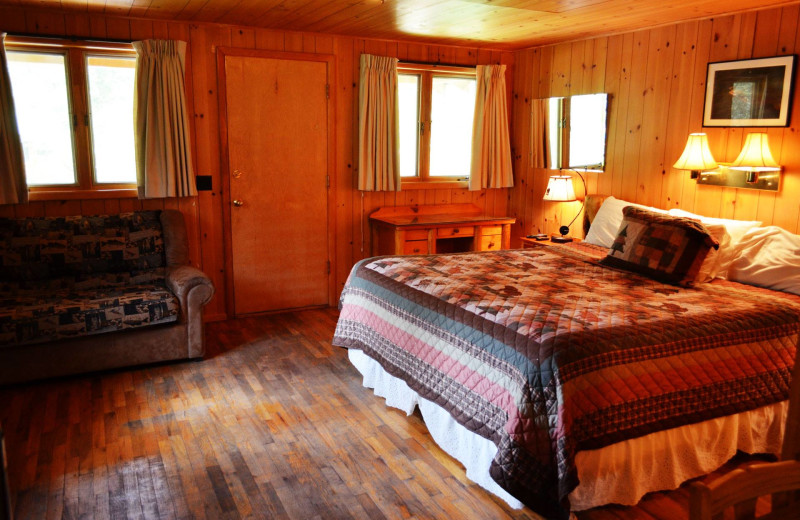 Cabin bedroom at Shoshone Lodge & Guest Ranch.