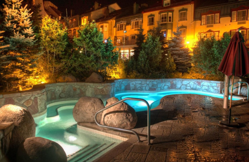 Outdoor pool at Homewood Suites by Hilton Mont-Tremblant Resort.