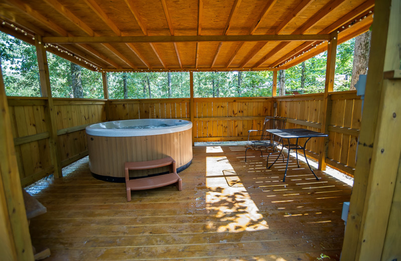 Cabin hot tub at Kiamichi Country Cabins.