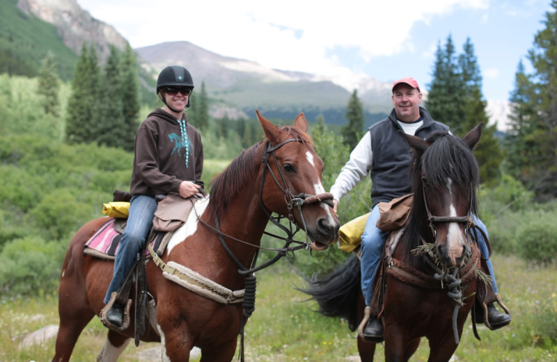 Horseback riding at Tumbling River Ranch.