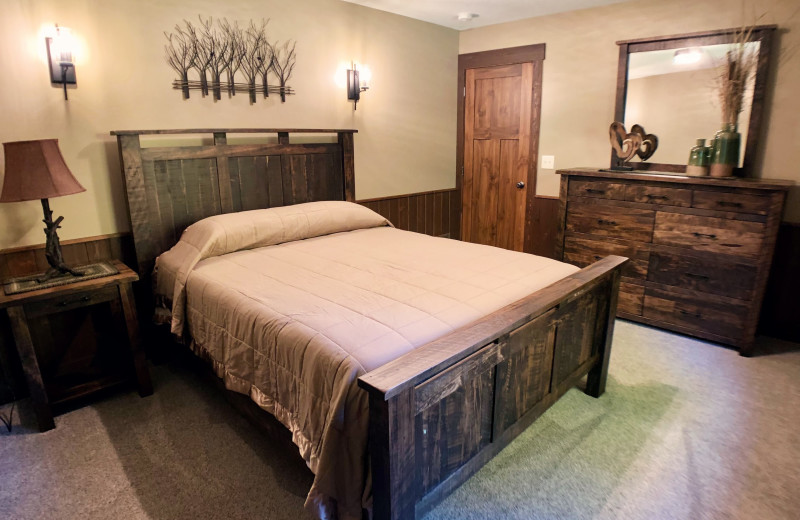 Suite bedroom at Sojourner's Lodge & Log Cabin Suites.