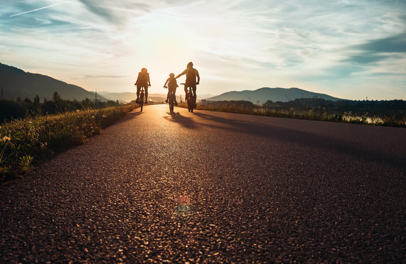 Family biking at Family Time Vacation Rentals.