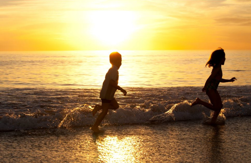 Kids on beach at Seagrove On The Beach Property Rentals.