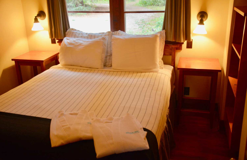 Cabin bedroom at Johnston Canyon Lodge & Bungalows.