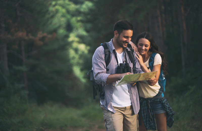 Couple hiking at Sisters Vacation Rentals.