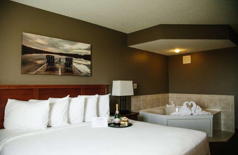 Guest room with hot tub at GrandStay Perham.