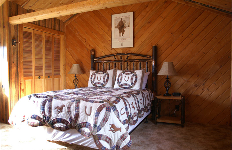 Cabin bedroom at Rand Creek Ranch.