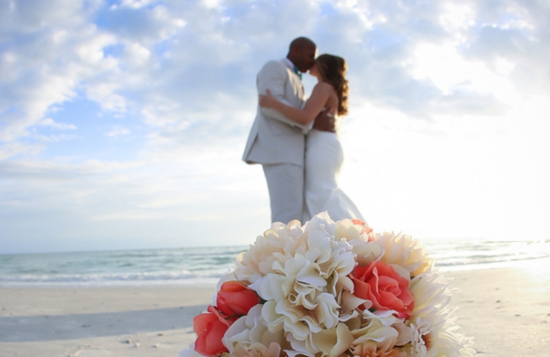 Wedding couple on beach at TradeWinds Island Grand.