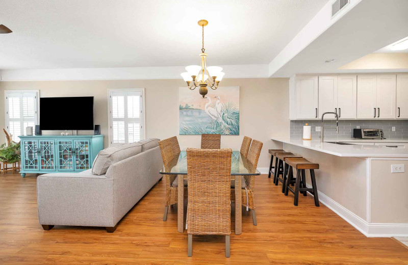 Living room and kitchen at Real Escapes Properties - St. Simons Grand 224.