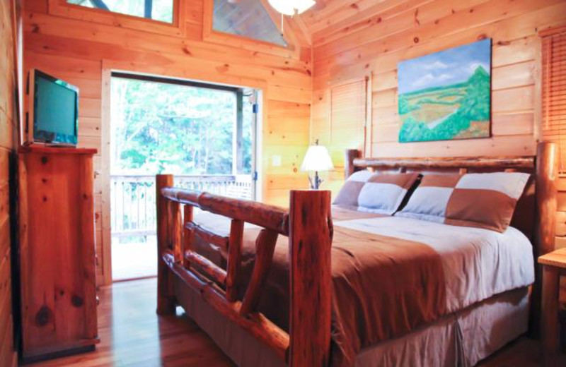 Cabin bedroom at Mountain Getaway Cabin Rentals.