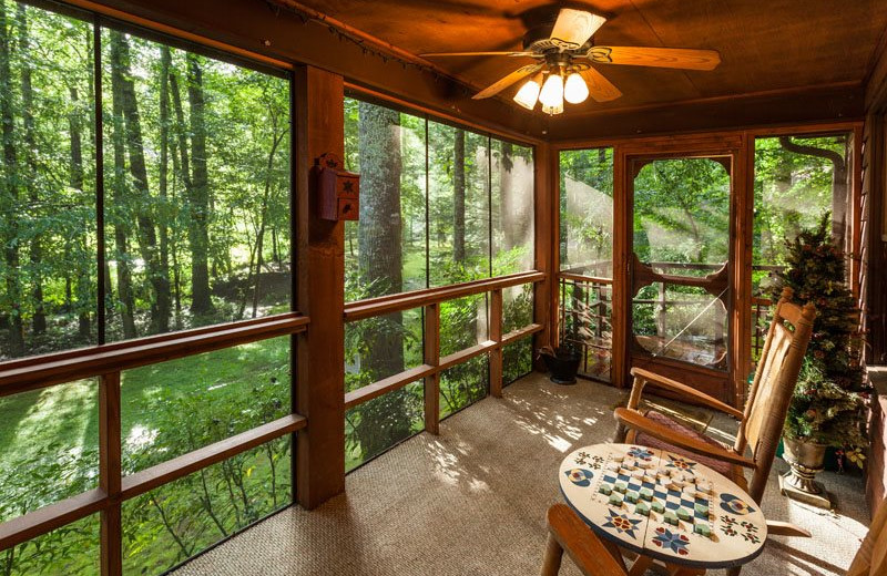 Cabin porch at Mountain Oasis Cabin Rentals.