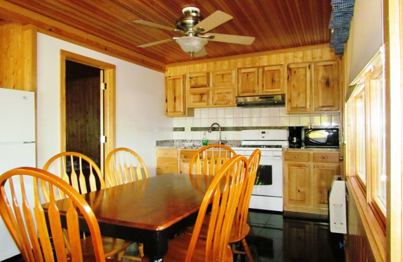 Cabin kitchen and dining area at Contessa Resort.