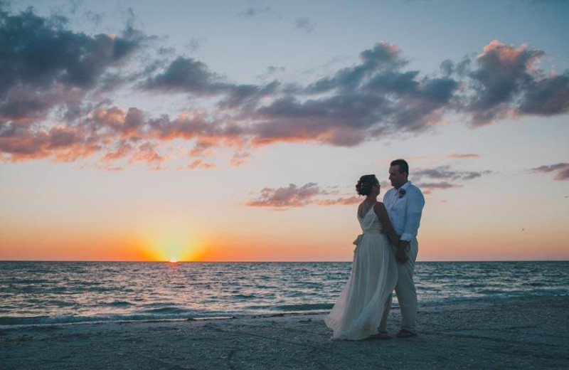 Wedding couple on beach at Palm Island Resort.