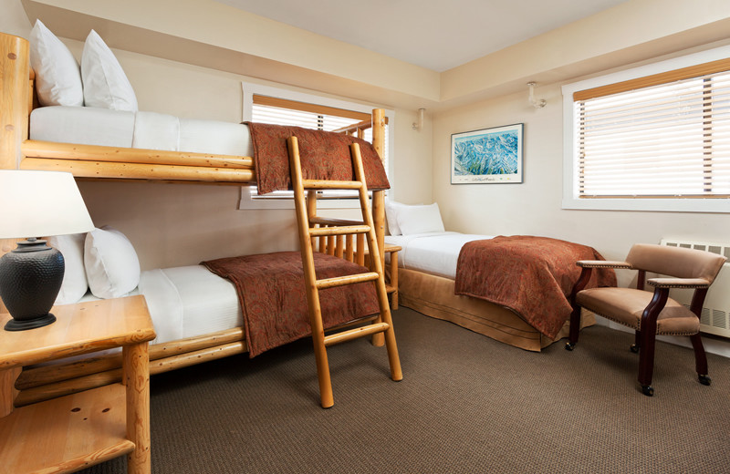 3 beds total (1 bunk bed and 1 twin), Small Private Bathroom with stand up shower, No TV and No Mountain View at Alta's Rustler Lodge.