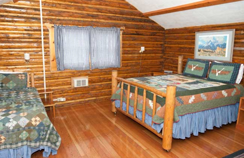 Cabin bedroom at Triangle X Ranch.