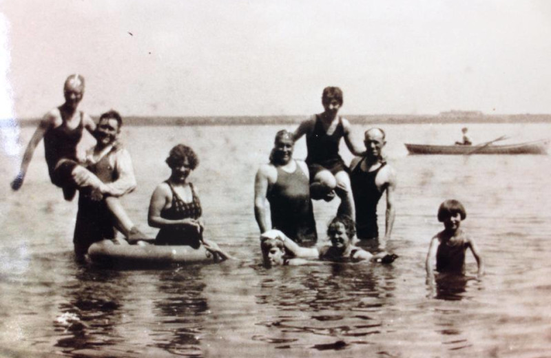 Historic photo of family swimming at Bonnie Beach Resort.