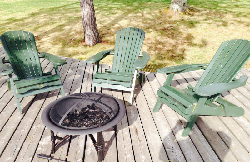 Fire pit on the dock overlooking the lake to enjoy each evening at Heather Lodge.