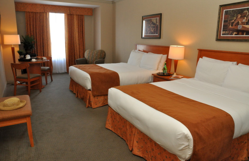 Guest room at The Prestige Harbourfront Resort & Convention Centre.