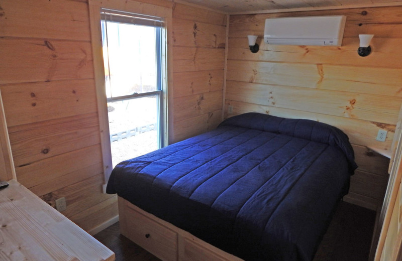 Cabin bedroom at Yogi Bear's Jellystone Park Gardiner.