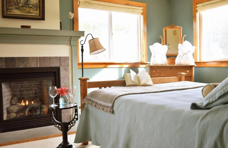 Guest room with fireplace at The Red Clover Inn & Restaurant.