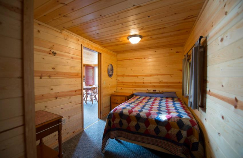 Cabin bedroom at Snyder's Idlewild Resort.